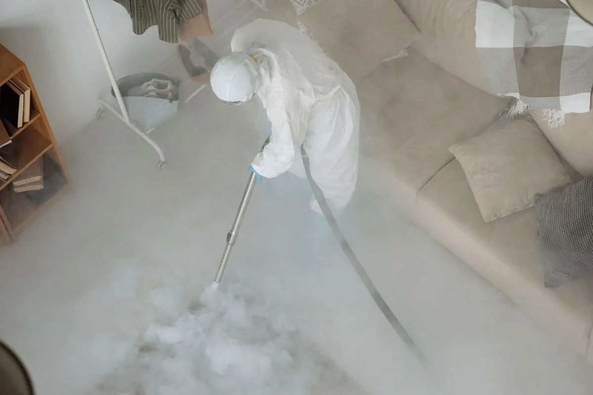 Biohazard cleanup technician in protective equipment, Chelsea, AL